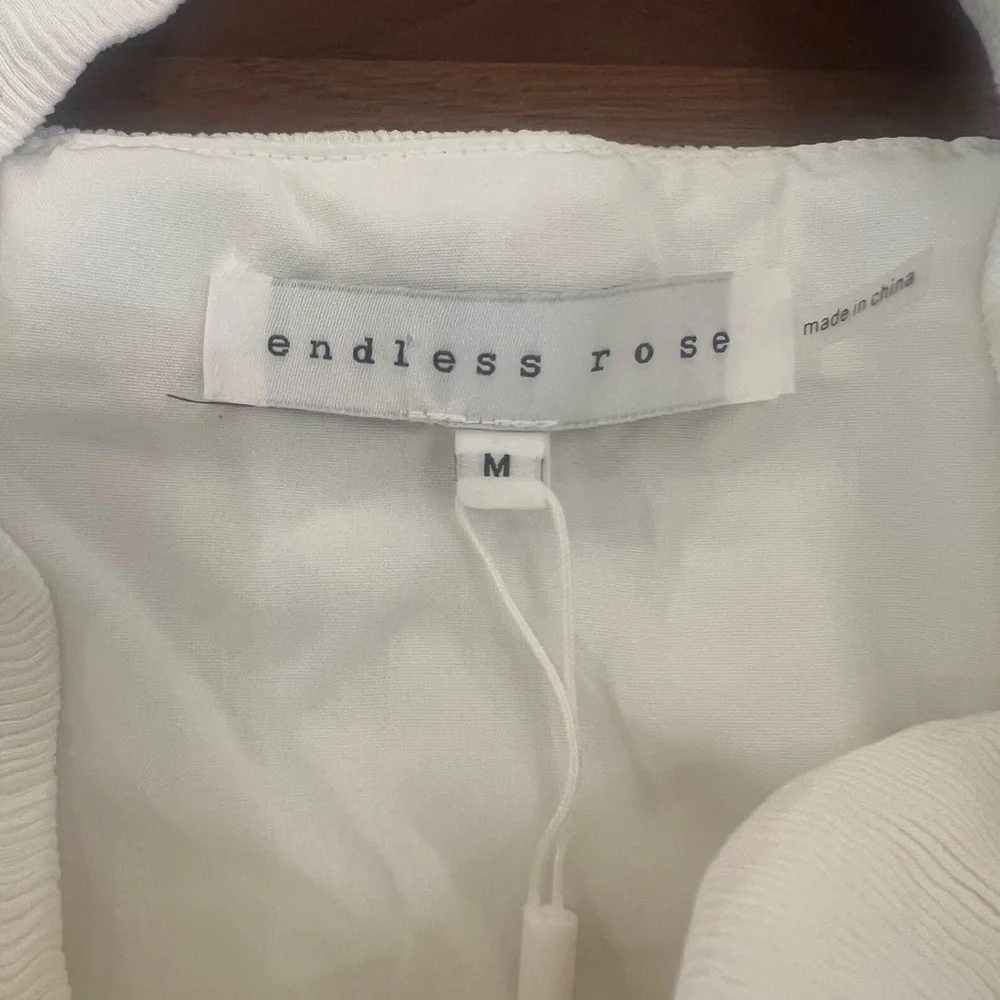 Endless Rose white SOFT TOUCH PLISSE TWIST MINI DRESS. Size M NWT
